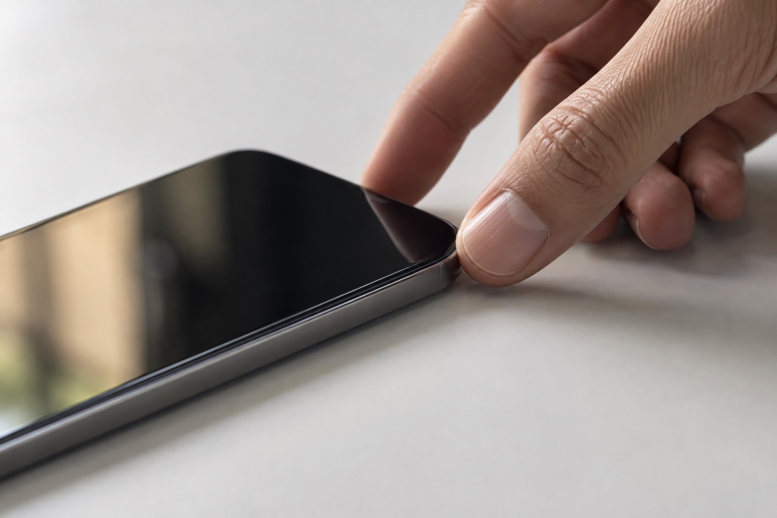 A conceptual close-up of fingertips touching a smartphone
